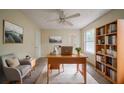 Well-lit home office with built-in bookshelves and ample workspace, perfect for productivity and comfortable remote work at 1060 Heatherwood Ct, Norcross, GA 30093