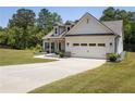 New single-Gathering home with a long driveway and a two-car garage at 2124 Bullock Bluff Dr, Loganville, GA 30052