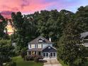 Beautiful two-story home nestled among lush trees with a well-manicured lawn at 2368 Glynn Se Dr, Atlanta, GA 30316