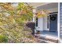 Inviting front porch entrance with a stylish blue door and beautiful landscaping at 2368 Glynn Se Dr, Atlanta, GA 30316