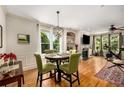 Cozy dining area with hardwood floors and natural light at 11271 Calypso Dr, Alpharetta, GA 30009