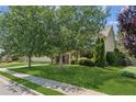 Inviting home with a manicured lawn and mature trees, offering great curb appeal on a sunny day at 558 Grand Ivey Pl, Dacula, GA 30019