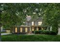 Beautiful two-story home featuring a well-maintained lawn, inviting front porch, and tasteful landscaping at 558 Grand Ivey Pl, Dacula, GA 30019