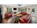 Inviting living room features fireplace, built-in bookshelves, and comfortable seating at 1518 Maplewood Ct, Woodstock, GA 30189