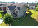 Aerial view of the house with large grassy area and wooden fence at 2600 Arnold Palmer Way, Duluth, GA 30096