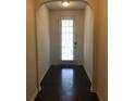 Welcoming entryway featuring dark wood floors and an arched doorway at 5671 Radford Loop, Fairburn, GA 30213