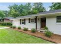 Close-up of the home's front exterior with new landscaping and an inviting front door at 2617 Warwick Ne Cir, Atlanta, GA 30345