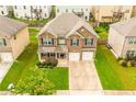 Beautiful two-story brick home featuring a manicured front lawn, complemented by an attached two-car garage at 3869 Maiden Fern Ln, Snellville, GA 30039