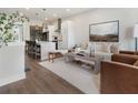 Open-concept living space flows to a modern kitchen, hardwood floors, and stylish decor at 921 Hughley Circle Se # 66, Atlanta, GA 30316