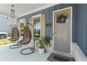 Inviting front porch featuring hanging chairs, stylish lighting, and a welcoming entrance at 876 Samples Nw Ln, Atlanta, GA 30318