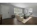 Bright living room with hardwood floors, lots of sunlight, and stylish furniture at 159 Lloyd Dr, Marietta, GA 30066