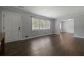 Bright living room showcasing hardwood floors, neutral paint, and a large window at 159 Lloyd Dr, Marietta, GA 30066