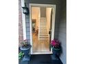 Bright entryway showcasing stairs with wood floors and a view into the home at 1910 Glynmoore Dr, Lawrenceville, GA 30043