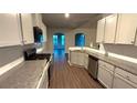 Well-equipped kitchen with stainless steel appliances and ample counter space at 210 Park Place Trl, Social Circle, GA 30025