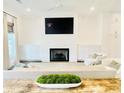 Inviting living room showcasing a fireplace, shiplap accent wall, and comfortable seating at 130 W Main Street # 1, Buford, GA 30518