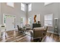 Bright living room with high ceilings, beautiful wood floors, and an abundance of natural light at 5473 Heatherbrooke Nw Dr, Acworth, GA 30101