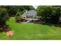 Beautifully landscaped backyard featuring lush greenery and a spacious layout for outdoor activities at 127 Grandmar Chase, Canton, GA 30115