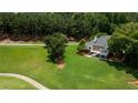 Expansive backyard with lush green lawn and a home with a deck, perfect for outdoor living at 127 Grandmar Chase, Canton, GA 30115