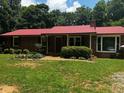 Close up showing the front of the home with an attractive brick facade and well-maintained landscaping at 199 Mckaskey Creek Se Rd, Cartersville, GA 30121