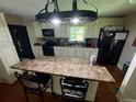 Eat-in kitchen with granite counters and white cabinets at 199 Mckaskey Creek Se Rd, Cartersville, GA 30121