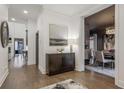 Bright foyer with hardwood floors, modern decor, and an open view to the dining area at 49 Conifer Park Ln, Atlanta, GA 30342