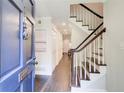 Inviting foyer with hardwood floors, staircase and view of the hallway at 1105 Clairemont Ave # J, Decatur, GA 30030