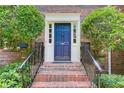 Elegant entryway featuring a classic blue front door with decorative trim and brick steps at 1105 Clairemont Ave # J, Decatur, GA 30030