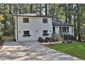 Charming white brick two-story home with a well-manicured lawn and inviting front entrance at 1770 Austin Dr, Decatur, GA 30032