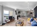 Bright living room featuring modern decor, hardwood floors, and a view into the kitchen at 795 Hammond Dr # 1012, Atlanta, GA 30328