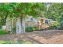 Charming single-story home with well-maintained landscaping and a covered front porch at 8767 N View Dr, Lithia Springs, GA 30122