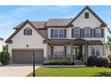 Charming two-story home featuring a brick and siding exterior, well-manicured lawn and a two-car garage at 5240 Bristlecone Pine Way, Cumming, GA 30040