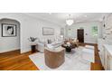 Bright living room features hardwood floors, stylish furniture, and neutral decor at 582 Lakeshore Ne Dr, Atlanta, GA 30307