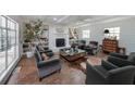 Bright living room featuring a fireplace, hardwood floors, and comfortable seating arrangements with natural lighting at 167 Garden Ln, Decatur, GA 30030