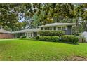 Charming home with a well-maintained front yard and a welcoming entrance with covered parking at 2416 Elmwood Se Cir, Atlanta, GA 30339