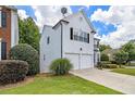 Two-story home showing siding, a manicured lawn and tidy landscaping at 3710 Ridgefair Dr, Cumming, GA 30040