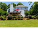 Expansive backyard featuring lush landscaping, a spacious deck, and a well-maintained lawn at 130 Hamilton Way, Roswell, GA 30075