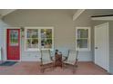 Relaxing front porch with seating area, ideal for enjoying the neighborhood views and fresh air at 1453 Cambridge Cmn, Decatur, GA 30033