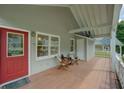 Inviting front porch with wooden flooring and space for relaxing, perfect for enjoying the outdoors at 1453 Cambridge Cmn, Decatur, GA 30033