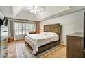 Comfortable bedroom with neutral tones, vaulted ceiling, and ample natural light at 615 Willowbrook Run, Johns Creek, GA 30022