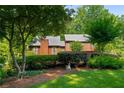 Beautiful two-story home surrounded by mature trees and manicured landscaping at 278 Shire Way, Lawrenceville, GA 30044