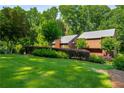 Well-maintained lawn and mature trees surround this two-story home at 278 Shire Way, Lawrenceville, GA 30044