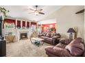 Inviting living room with cozy fireplace, neutral carpet, and bright windows at 3198 Liberty Commons Dr, Kennesaw, GA 30144