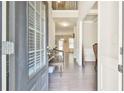 Inviting foyer with hardwood floors, neutral paint, and views into the formal dining and living spaces at 2102 Black Pebble Cir, Buford, GA 30519