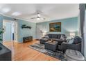 Inviting living room featuring hardwood floors, a sectional sofa, and neutral decor at 1445 Monroe Ne Dr # F12, Atlanta, GA 30324