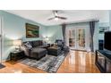 Comfortable living room with a plush sofa, modern rug, and bright natural light at 1445 Monroe Ne Dr # F12, Atlanta, GA 30324
