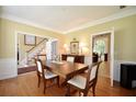 Elegant dining room offers hardwood floors and view to living spaces at 340 Channings Lake Dr, Lawrenceville, GA 30043