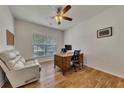 Bright office with hardwood floors, a large window, and a comfortable recliner at 320 Pebblestone Ln, Canton, GA 30115