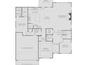 Layout of the first floor featuring a kitchen, guest suite, dining room, library, and a 2-car garage at 4790 Wayt Farm Overlook, Cumming, GA 30040