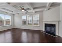 Open-concept living room with fireplace, hardwood floors and bright, natural light at 2231 Bedell Dr, Conyers, GA 30094