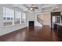 Bright living room features coffered ceilings, fireplace, and hardwood floors at 2231 Bedell Dr, Conyers, GA 30094
